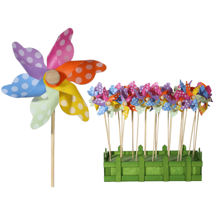Multicoloured windmilll with white dots on wooden,